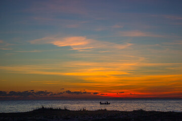 fisherman at sunset in the Ionian sea of Gallipoli