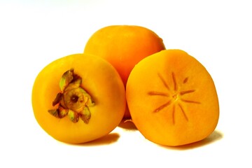 Fototapeta na wymiar yellow ripe persimmon isolated on white background