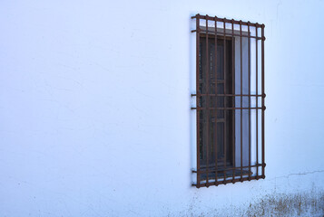 window with a forged grille in a Castilian house