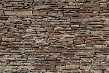 Old brick wall of rough stone