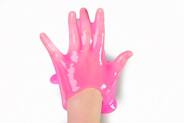 Hand Playing with textured slime with bubbles, stretching the gooey substance. Female teen hand holding pink shining slime, squeezing it. Adorable Girl stretching slime toy to the sides. Liquid toy