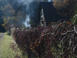 Smoke behind a fence