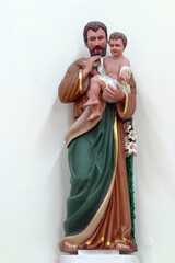 St. Joseph holds a child of Jesus, a statue in the parish church of St. Paul in Retkovec, Zagreb, Croatia