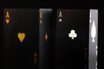 Black poker cards. Close-up. Minimalism. There are no people in the photo. Gambling, poker, casino, game strategy, advertisement, banner, poster, cash flow, risk.