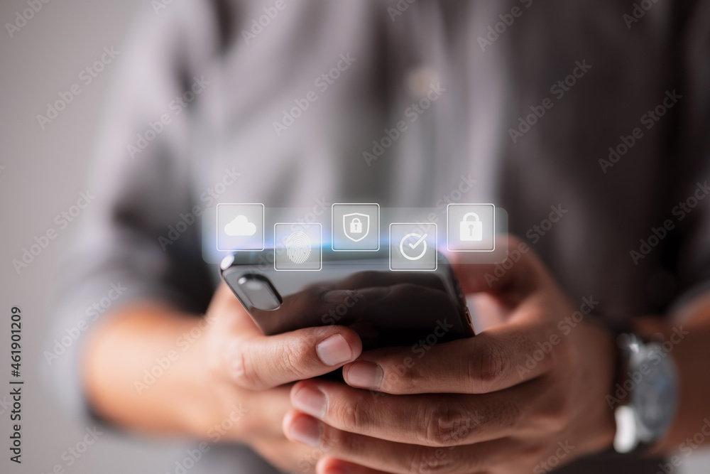Poster Technology concept involving cybersecurity, the internet, and networking, with a man using a smartphone and a padlock icon on a digital display.