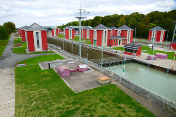 Historic lock, floodgate of the Mittelland Canal in Hanover, in operation since year 1928, barge of...
