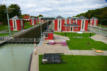 Historic lock, floodgate of the Mittelland Canal in Hanover, in operation since year 1928, barge of...