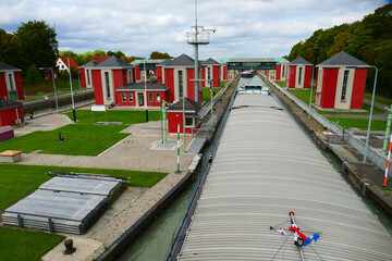 Historic lock, floodgate of the Mittelland Canal in Hanover, in operation since year 1928, barge of...