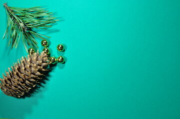 Christmas picture. Pine branch, pine cone and golden balls. Year of the tiger. Turquoise...