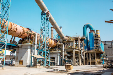 Cement factory. Pipes and compressors, equipment, metalurgy. Modern technologies work at a cement...