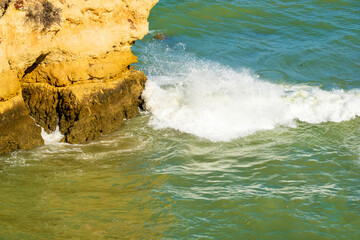 emerald sea, rock and cliffs at Dona Ana beach in Lagos, Algarve, Portugal