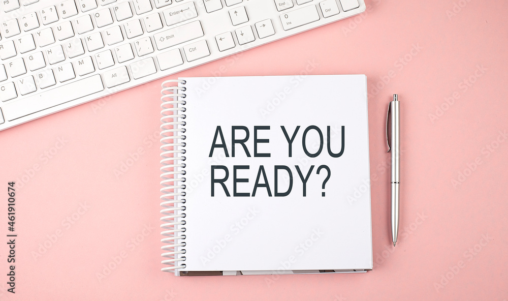 Poster pink office desk with keyboard and notebook with text are you ready