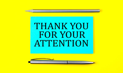 text THANK YOU FOR YOUR ATTENTION on the blue sticker on the yellow background