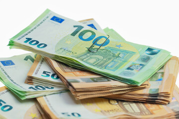 Obraz na płótnie Canvas Six bundles of euro notes, 100s and 50s.