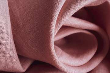 Natural linen fabric texture. Textured pink fabric background. Macro with shallow dof