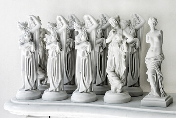 Set of marble feminine statuettes
