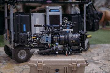 Fototapeta premium A professional film and video camera on the set. Filming day, equipment and crew. Technique of modern video filming.