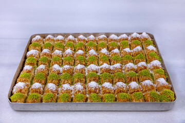 Delicious Turkish Baklava dessert on tray. Turkish Dessert Baklava with concept background....