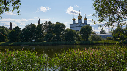 Russia. Joseph-Volokolamsk Monastery. View across the Guryevskoe lake. Resurrection and Clock Towers. Assumption Cathedral