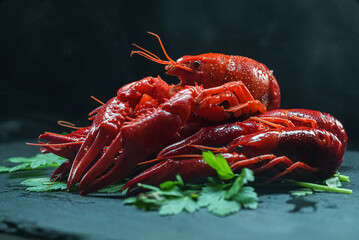 Red boiled cooked crayfish crawfish on tabletop.