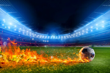 Soccer ball in flame goes fast to the stadium field