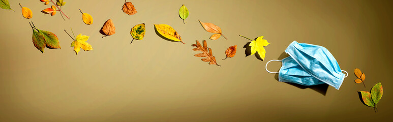 Facial masks with autumn leaves - flat lay
