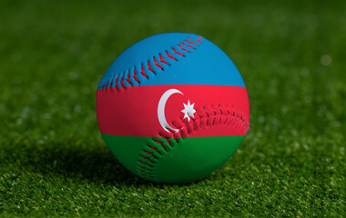 Baseball with Azerbaijan flag on green grass background, close up
