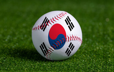 Baseball with Korea South flag on green grass background, close up