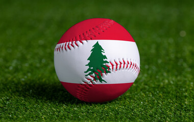 Baseball with Lebanon flag on green grass background, close up