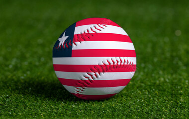 Baseball with Liberia flag on green grass background, close up