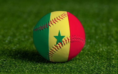 Baseball with Senegal flag on green grass background, close up