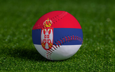 Baseball with Serbia flag on green grass background, close up