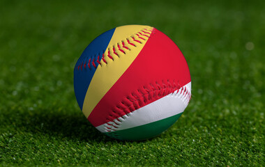 Baseball with Seychelles flag on green grass background, close up