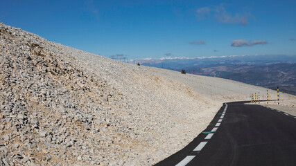 High up slopes of Mont Ventoux in Provence looking out at clouds with renewed road surface
