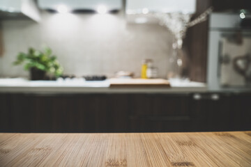 Wooden table top on blur kitchen room background. For displaying the assembly product or visual arrangement of the configuration keys