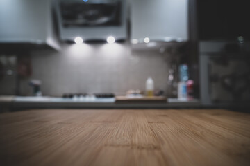 Wooden table top on blur kitchen room background. For displaying the assembly product or visual arrangement of the configuration keys