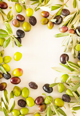 New crop mixed olives and leaves frame on white background with copy space.This image can be used vertically or horizontally. 