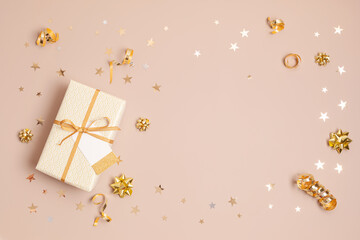 Christmas background with gift boxes wrapped in golden colored paper. Xmas celebration, preparation...