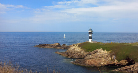 Seascape whit the lighthouse of 'Pancha island' in the coast of Ribadeo, Galicia, Spain