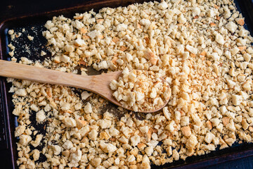 Homemade Breadcrumbs on a Baking Sheet: Freshly toasted breadcrumbs on a sheet pan