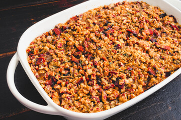 Bourbon Sweet Potato Casserole Topped with Toasted Pecans and Crumbled Bacon: Sweet potato casserole with pecan topping in a baking dish