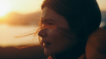 portrait of woman at sunset in the mountains