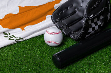 Baseball bat, glove and ball near Cyprus flag on green grass background