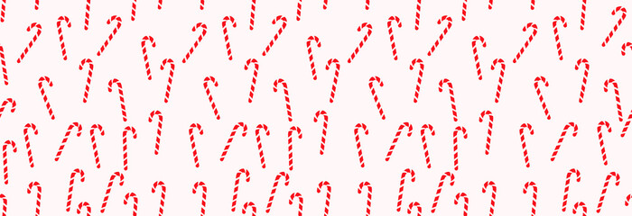 Seamless pattern, Christmas peppermint candy cane on a light background.