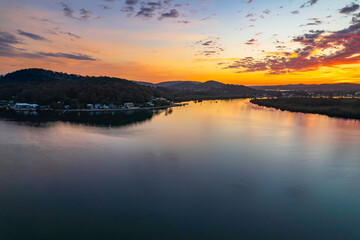Sunrise waterscape and clouds with reflections