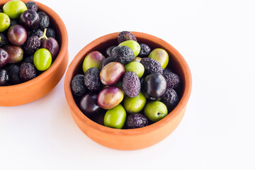 New crop mixed olives in casserole bowl on white background,harvest concept