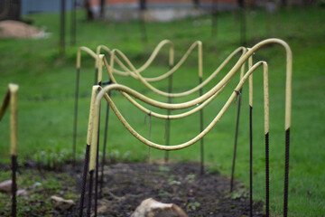 Racks for keeping plants in the garden. Supports for plants.