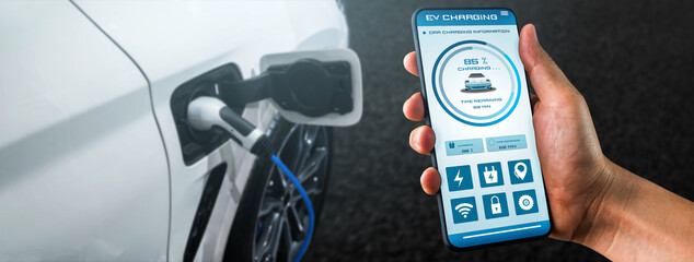 EV charging station for electric car with mobile app display charger status . The electric power is...