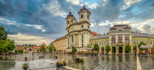 Panoramic view of Dobo square with the baroque church, Eger castle stormy weather sky in Hungary 