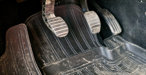 Car pedals with gas and brake.